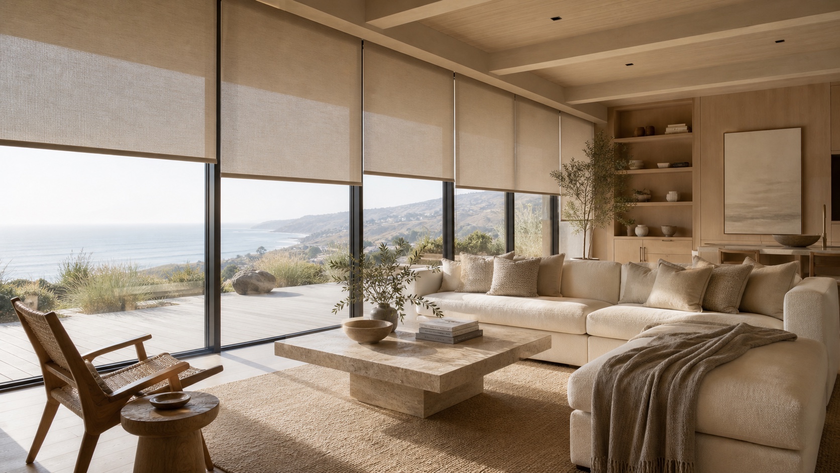 Coastal living room with wide roller shades and ocean view