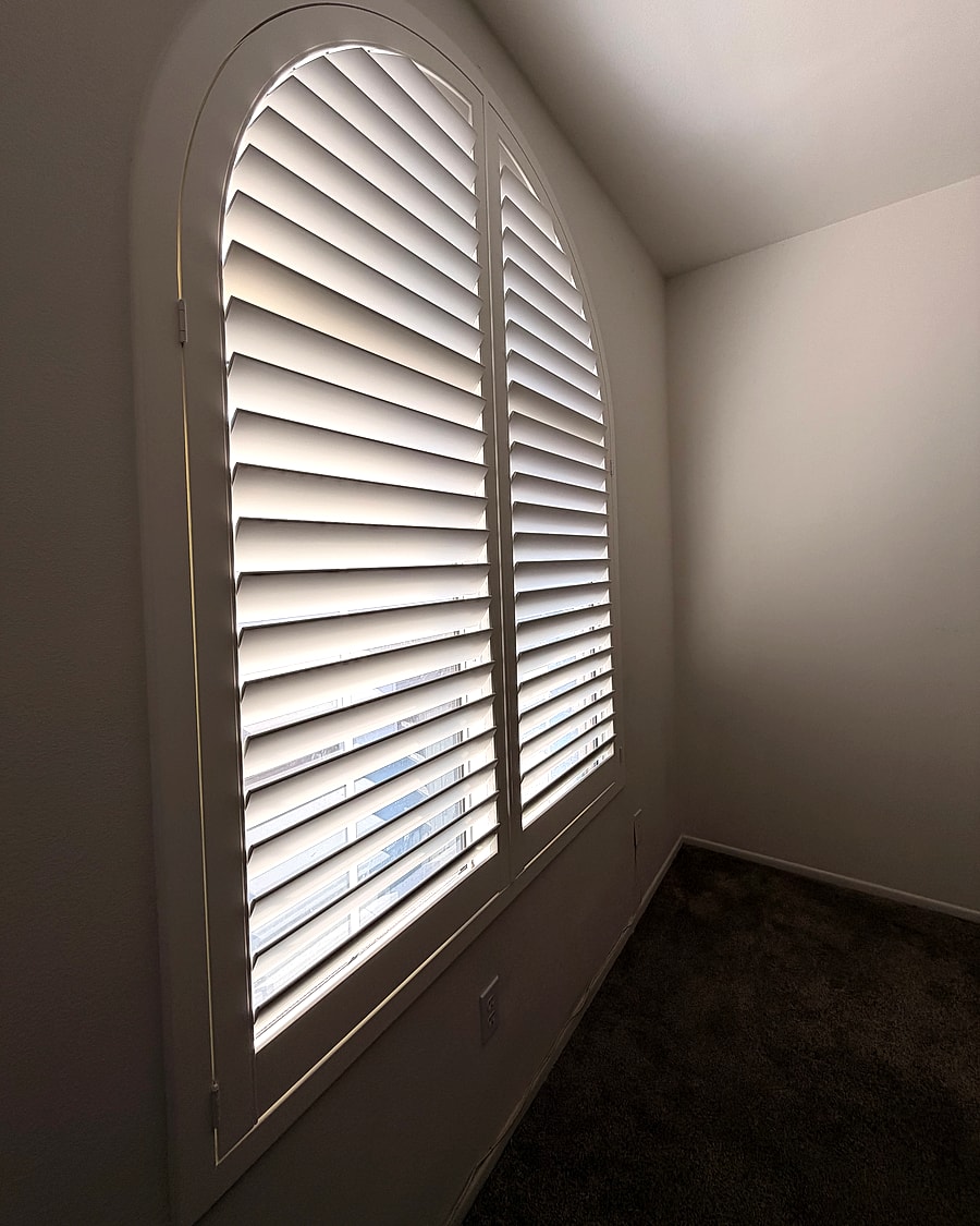 Arched plantation shutters installed in a Ventura County home
