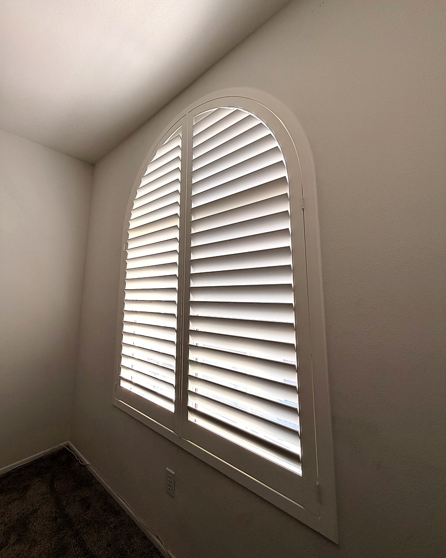 Custom arched shutter installed in a Ventura County room